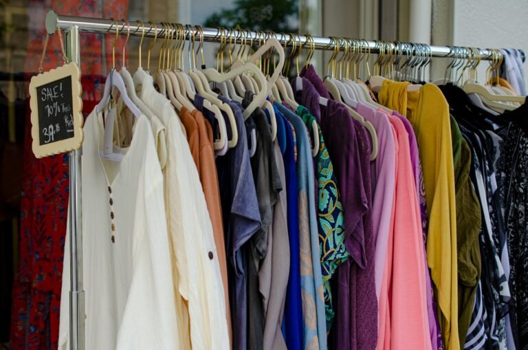 Diverse clothing rack representing the marketplace coverage comparison of AI listing tools