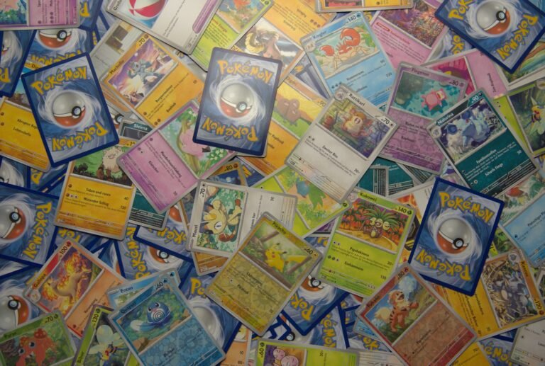 Pokemon trading cards spread on a table representing Whatnot live auction inventory