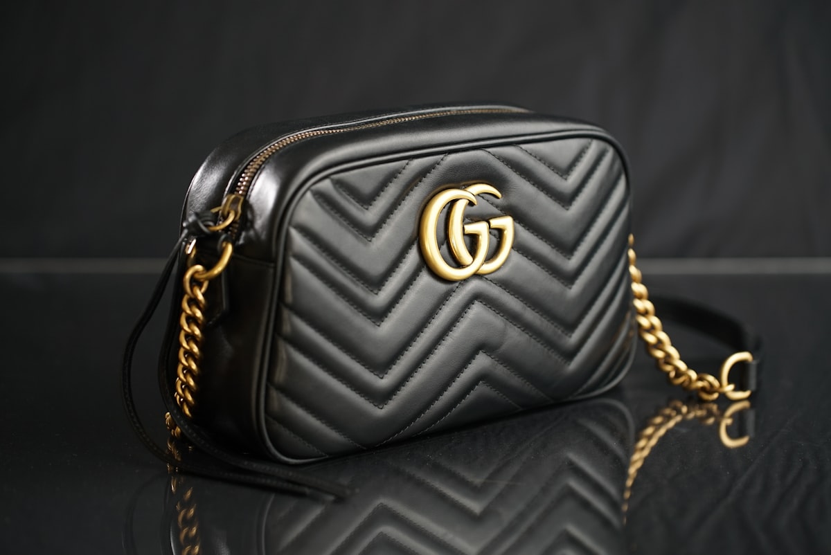 Designer quilted handbag with a gold chain for resale
