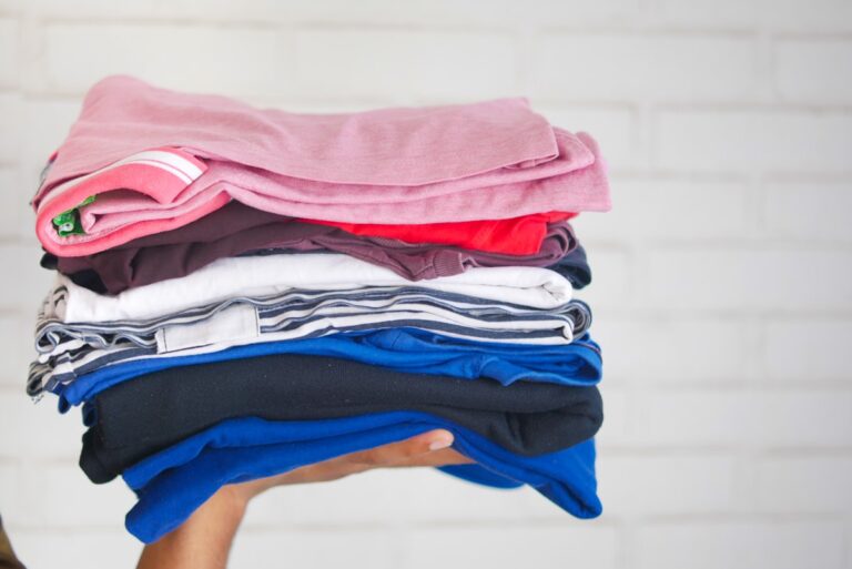 Stack of neatly folded children's clothes ready to resell