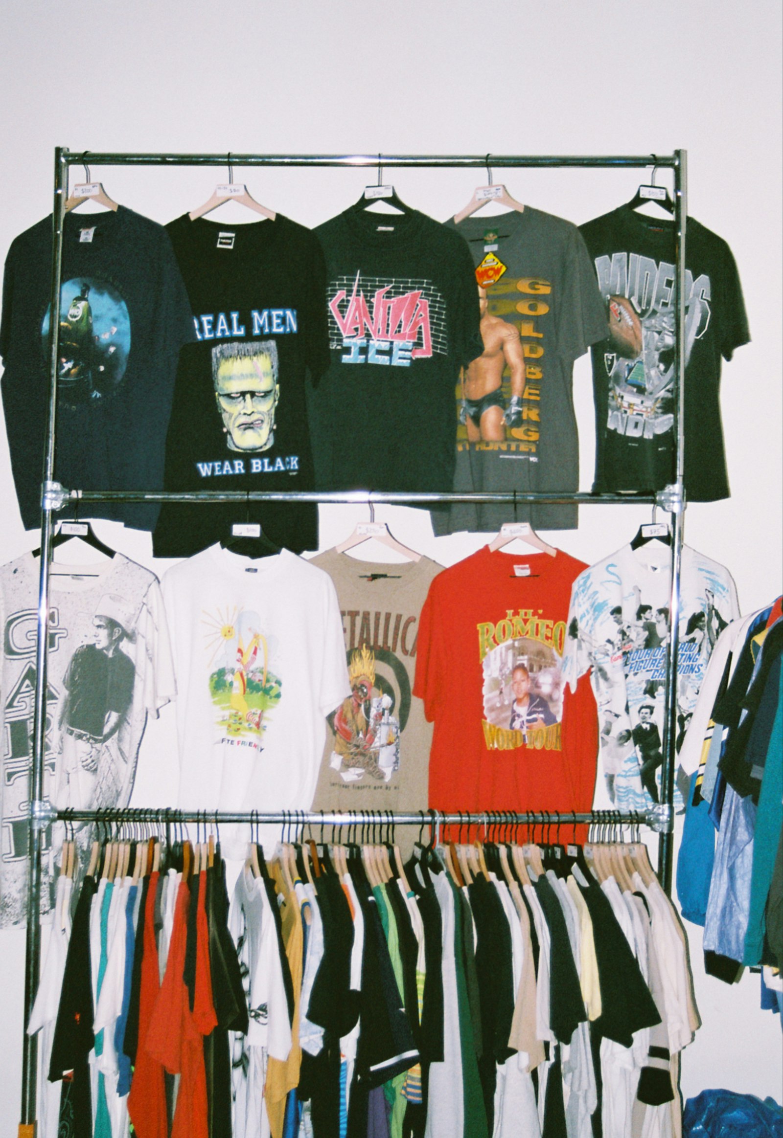 Rack of vintage graphic t-shirts from different eras