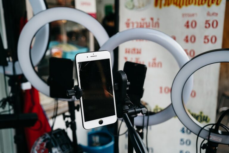 Smartphone on a tripod with ring lights set up for live selling