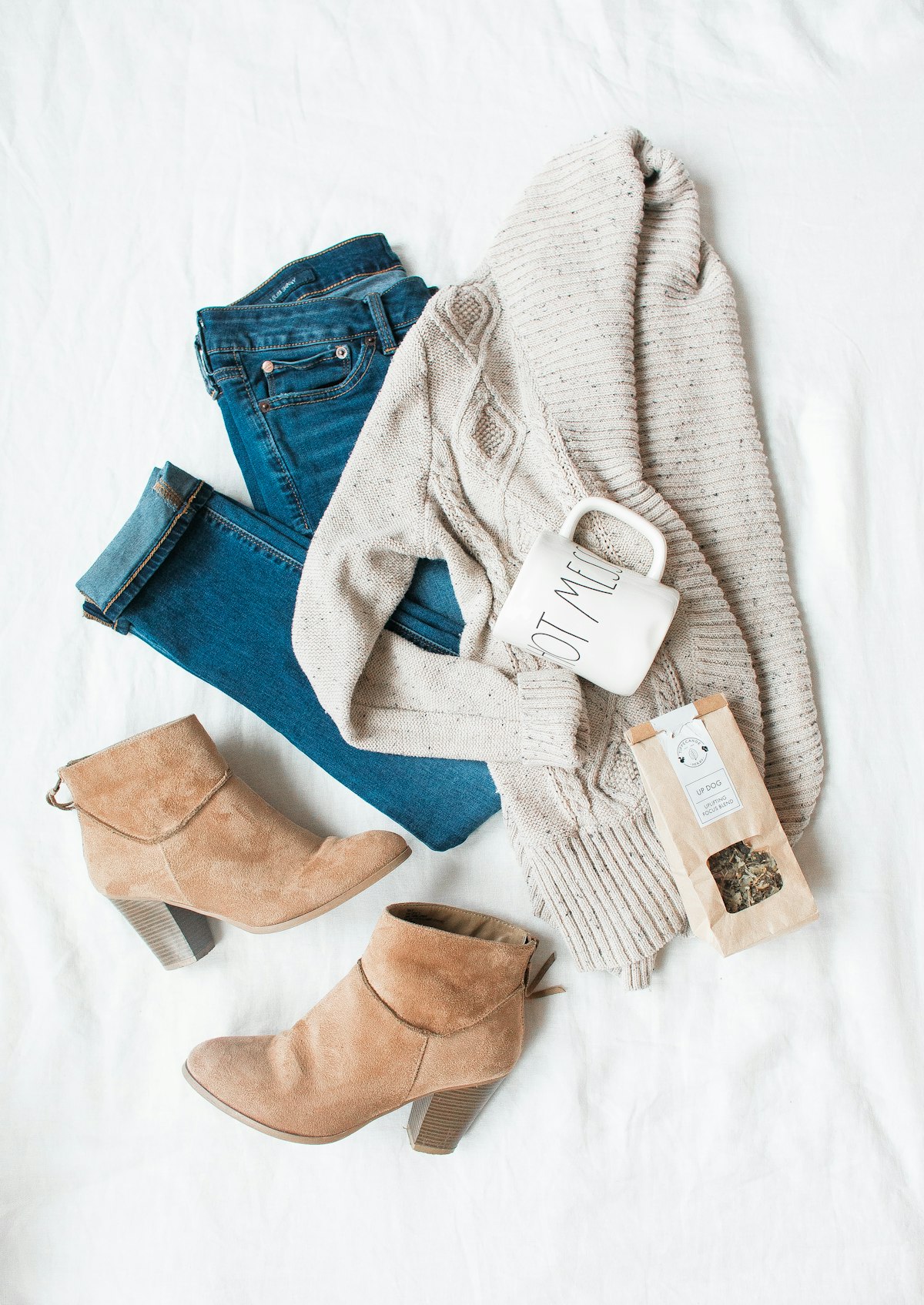 Neatly styled flat lay of folded fashion items ready to list for resale