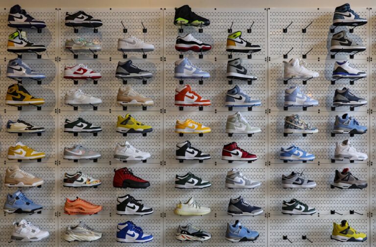 Wall display of sneakers organized for resale
